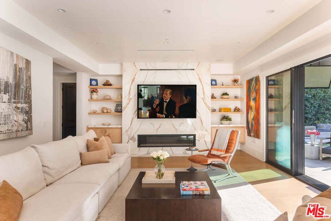 4533 Gentry Avenue Studio City, CA 91607 - Photo 8 of 39 a living room with furniture and a flat screen tv