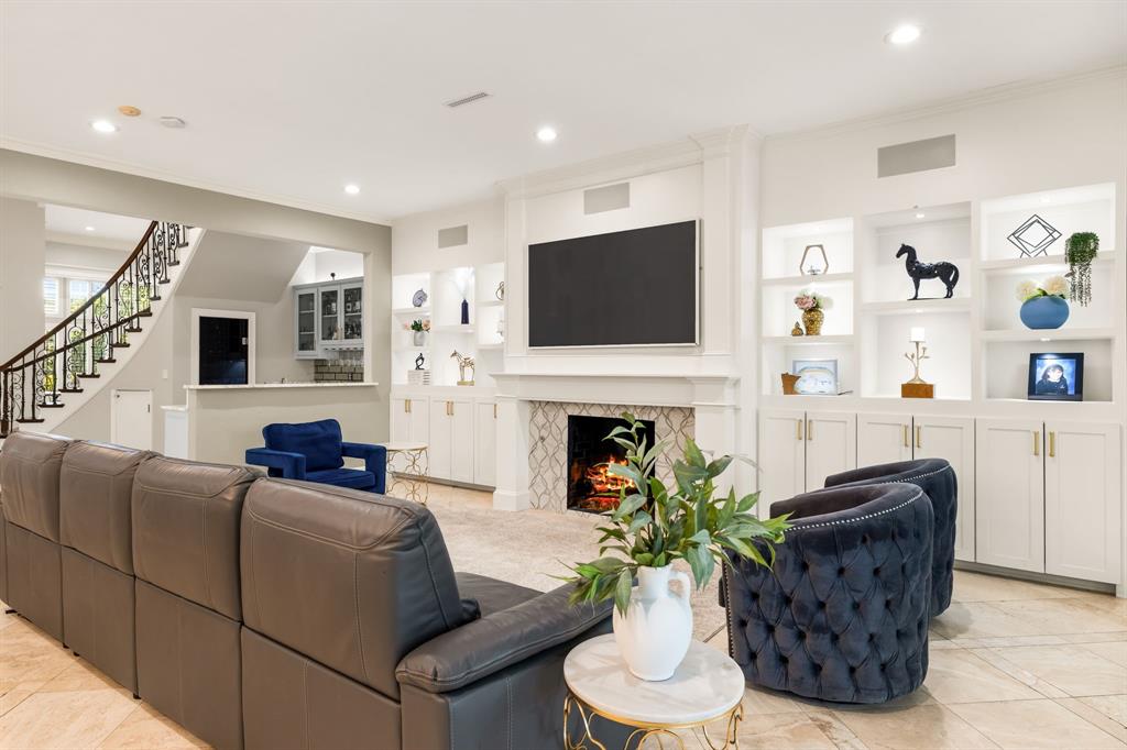 1904 MacGregor Drive Plano, TX 75093 - Photo 11 of 38 Den with Fireplace, Built-ins, and Wet Bar