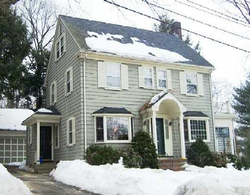 7 Plymouth Road Lexington, MA 02421 - Photo 1 of 1 a front view of a house with a yard and potted plants