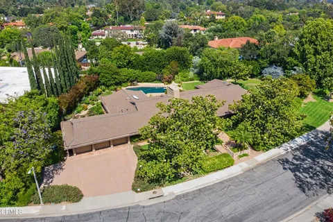 an aerial view of a house with a garden