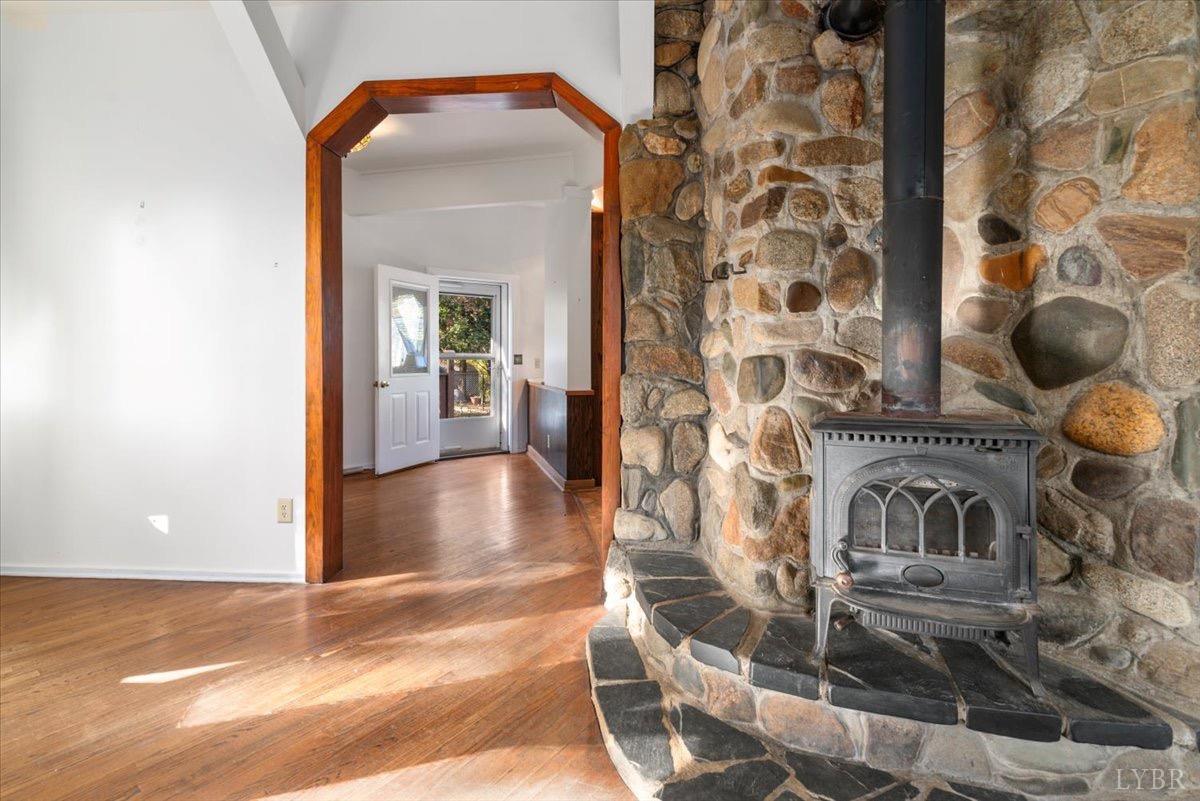 1052 Sardis Road Amherst, VA 24521 - Photo 13 of 46 a view of a livingroom with wooden floor and a fireplace