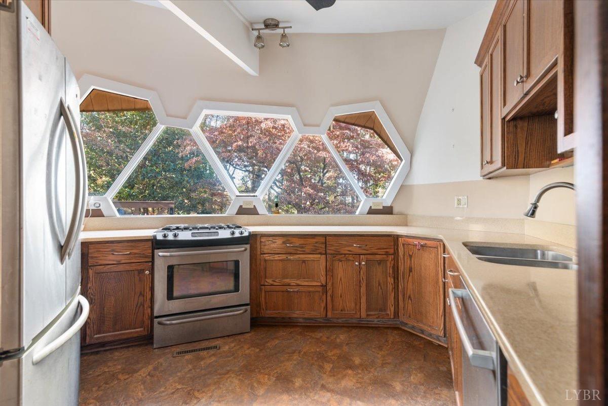 1052 Sardis Road Amherst, VA 24521 - Photo 16 of 46 a kitchen with stainless steel appliances granite countertop a stove and a sink