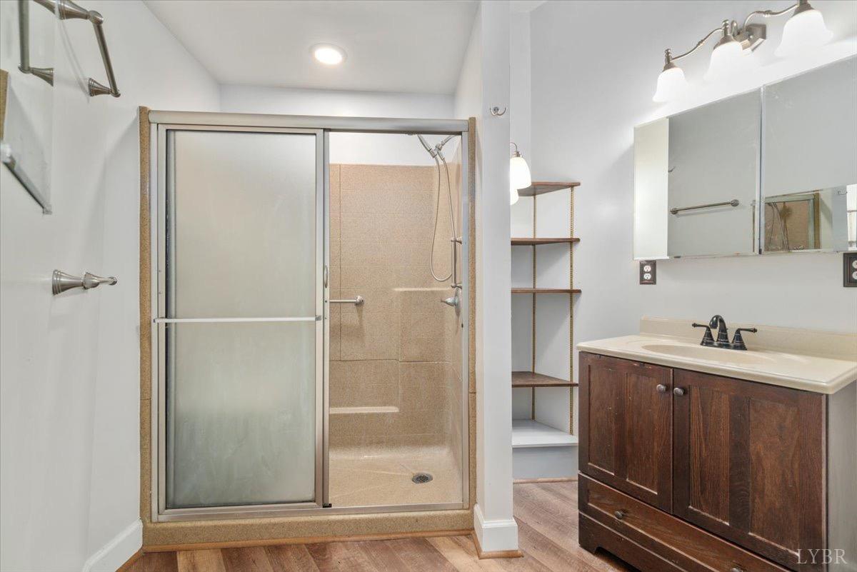 1052 Sardis Road Amherst, VA 24521 - Photo 24 of 46 a bathroom with a shower sink and mirror