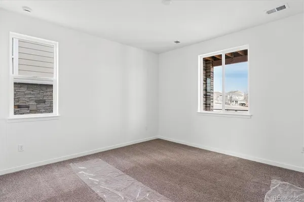 an empty room with windows