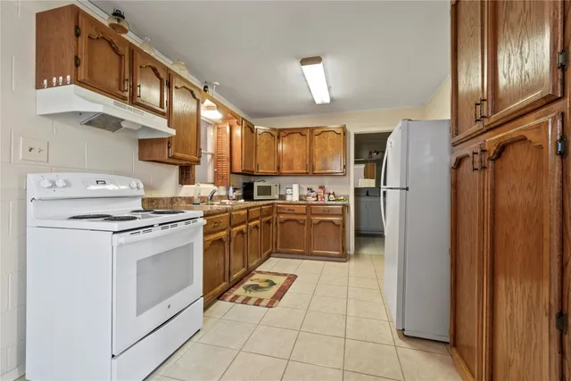 a kitchen with cabinets and steel stainless steel appliances