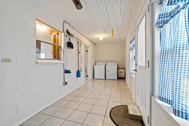 a bathroom with a sink a toilet and a window