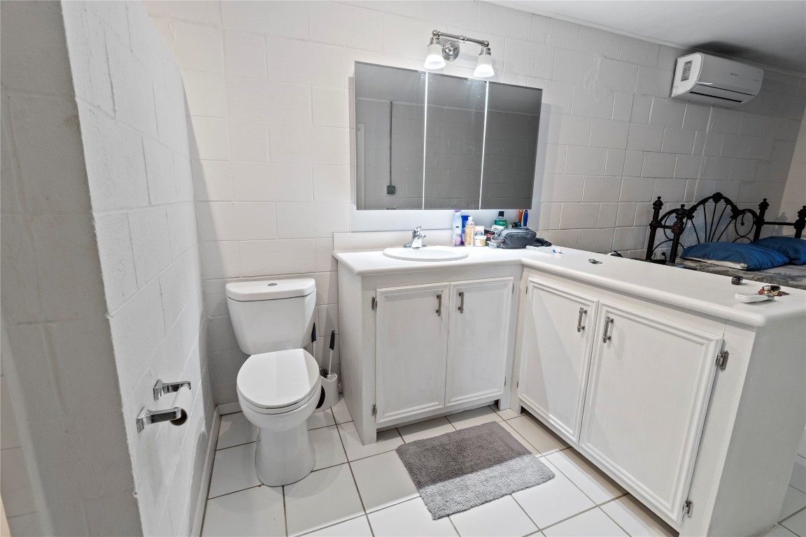 106 Overview Drive Zapata, TX 78076 - Photo 20 of 23 a spacious bathroom with a toilet sink and mirror
