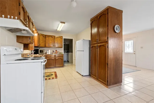 a kitchen with cabinets and stainless steel appliances