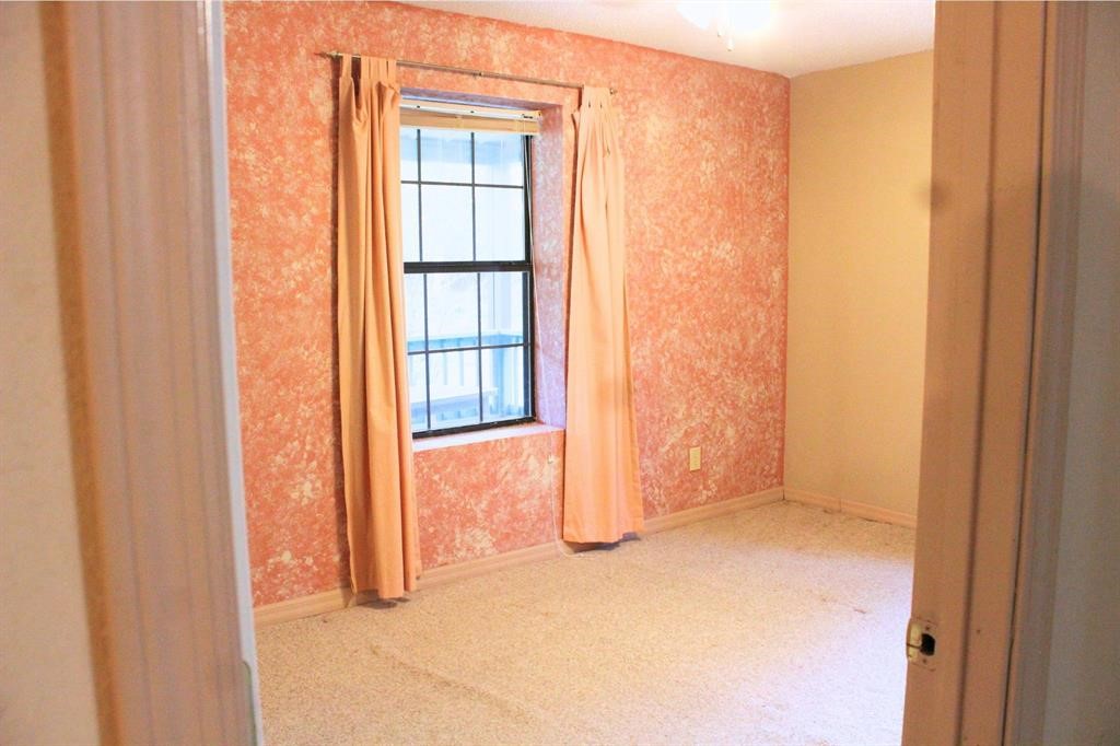 1493 Mollywood Road Zavalla, TX 75980 - Photo 13 of 22 a view of an empty room with a window