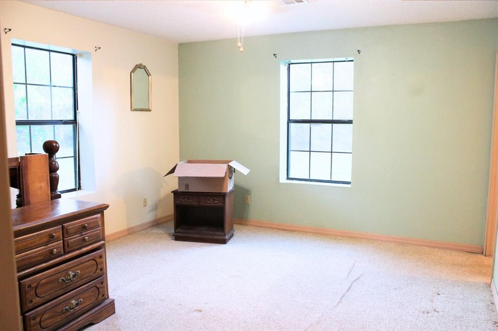 1493 Mollywood Road Zavalla, TX 75980 - Photo 14 of 22 a room with furniture and a window