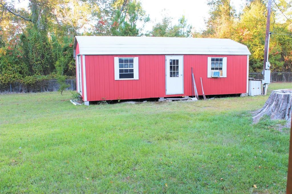 1493 Mollywood Road Zavalla, TX 75980 - Photo 7 of 22 a view of a backyard with green space