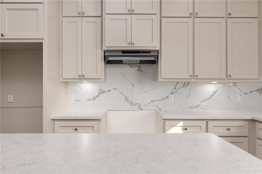 349 Barcelona Street Donna, TX 78537 - Photo 15 of 19 a kitchen with cabinets and white appliances