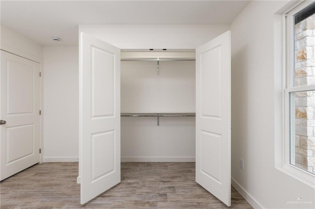 349 Barcelona Street Donna, TX 78537 - Photo 8 of 19 an empty room with windows and closet