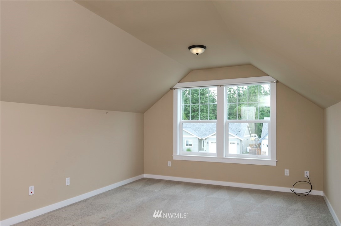 1810 Watkins Road Freeland, WA 98249 - Photo 22 of 34 a view of room with window and hardwood floor