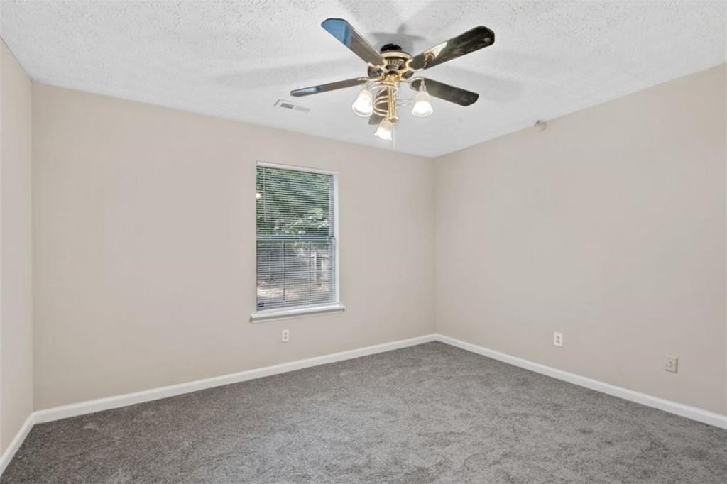 7519 Conkle Road Jonesboro, GA 30236 - Photo 15 of 35 an empty room with a window