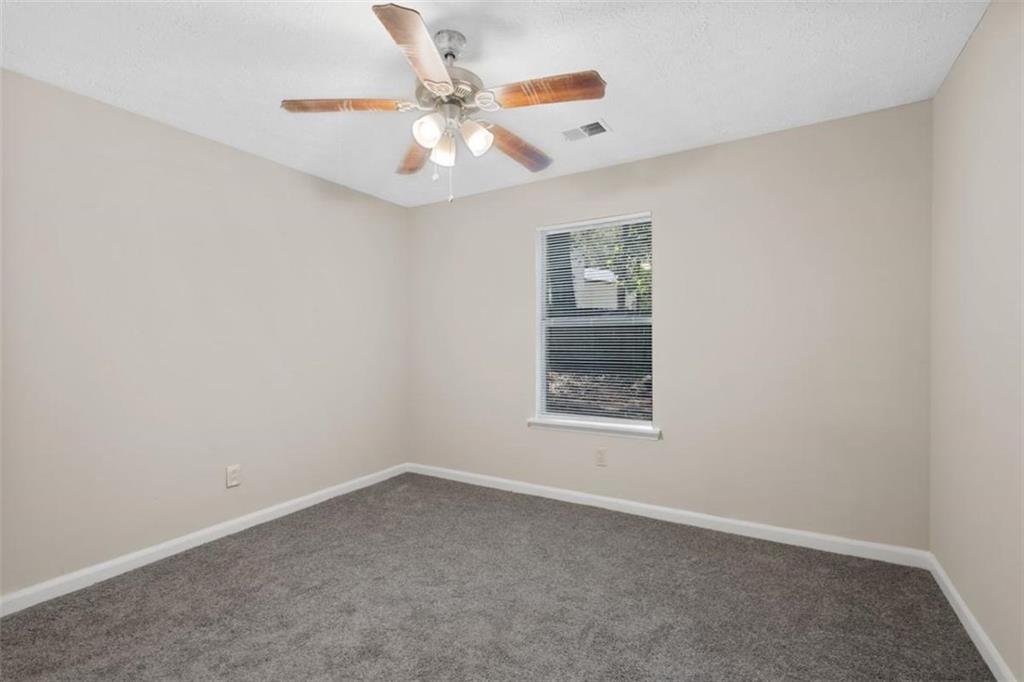 7519 Conkle Road Jonesboro, GA 30236 - Photo 18 of 35 an empty room with a window