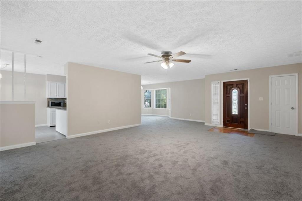 7519 Conkle Road Jonesboro, GA 30236 - Photo 5 of 35 a view of empty room with a ceiling fan