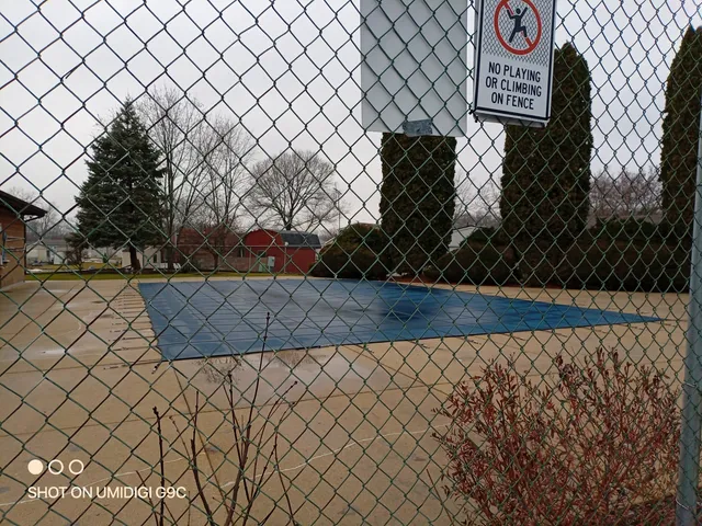 a view of a backyard with sitting area