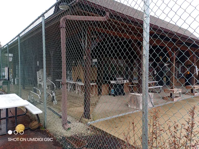 a view of a building with a backyard of the house