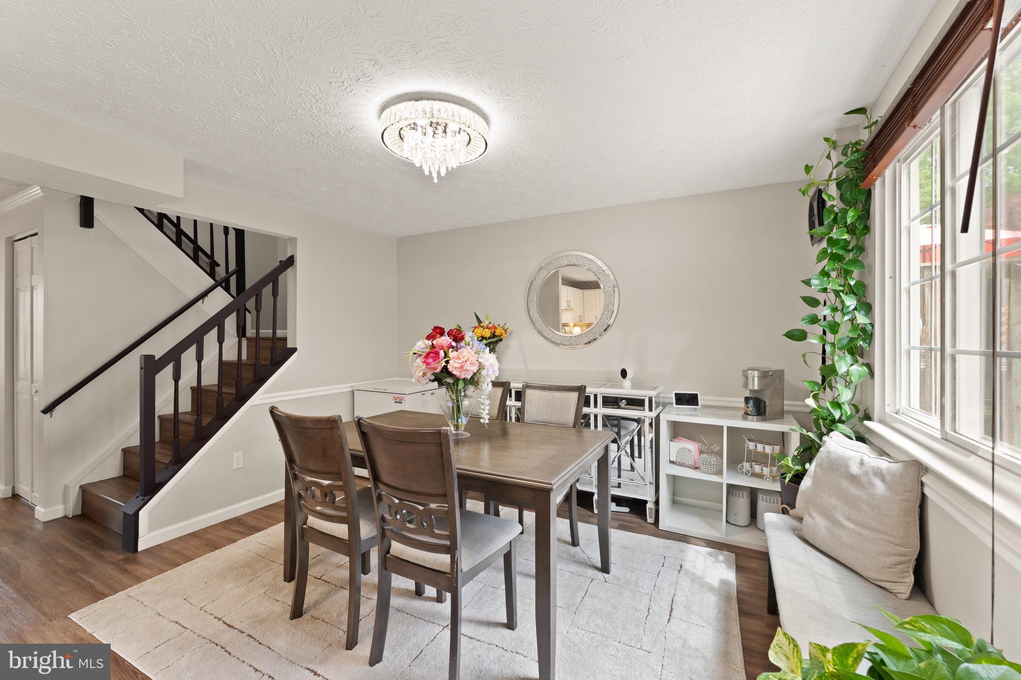 1617 Sierra Woods Drive Reston, VA 20194 - Photo 11 of 39 a view of a dining room with furniture window and wooden floor