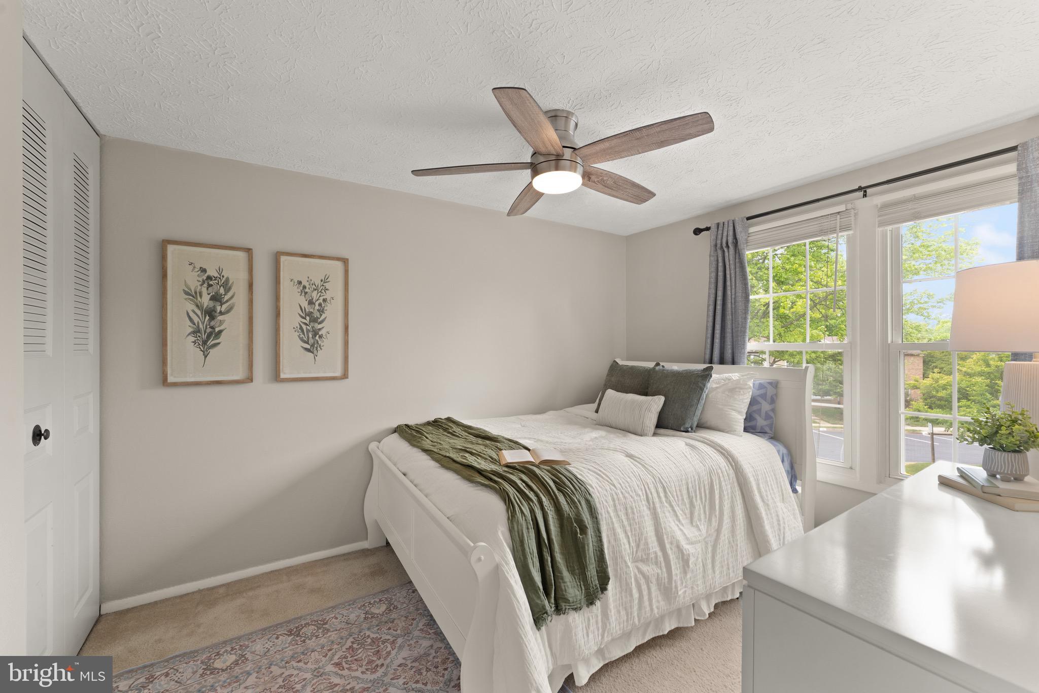 1617 Sierra Woods Drive Reston, VA 20194 - Photo 29 of 39 a bed room with a bed and a chandelier