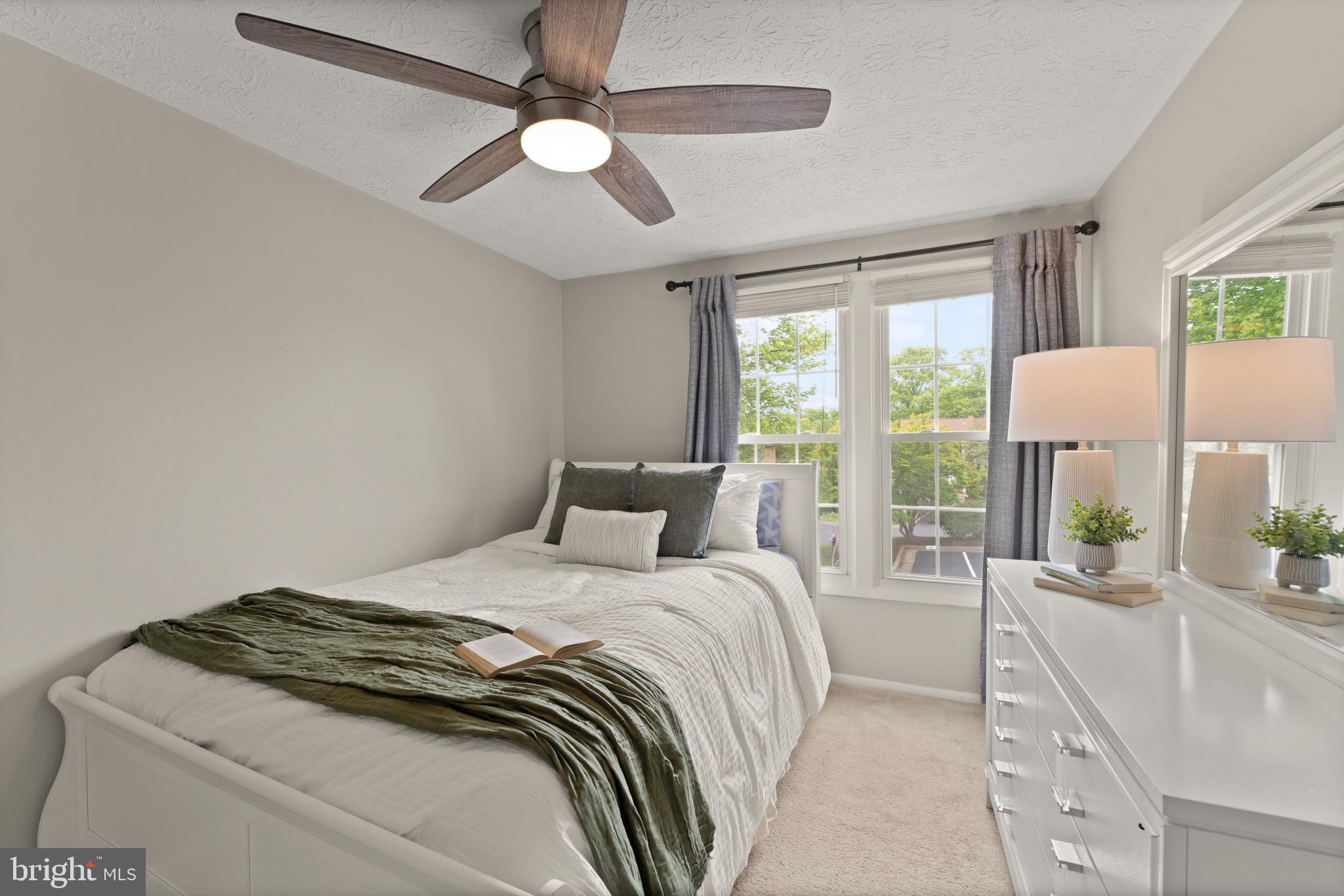 1617 Sierra Woods Drive Reston, VA 20194 - Photo 30 of 39 a bedroom with a large bed and a large window