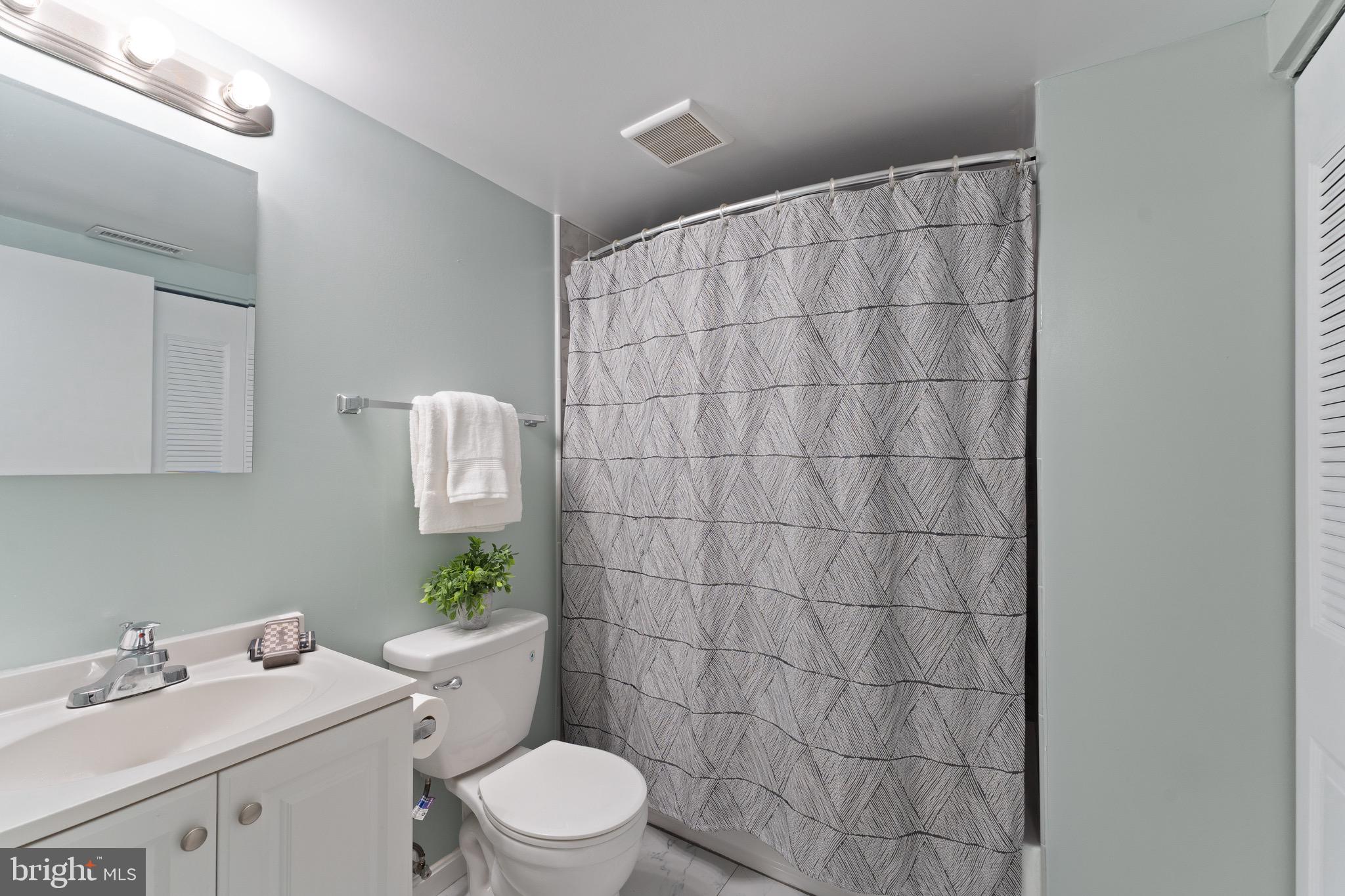 1617 Sierra Woods Drive Reston, VA 20194 - Photo 32 of 39 a bathroom with a sink toilet and shower