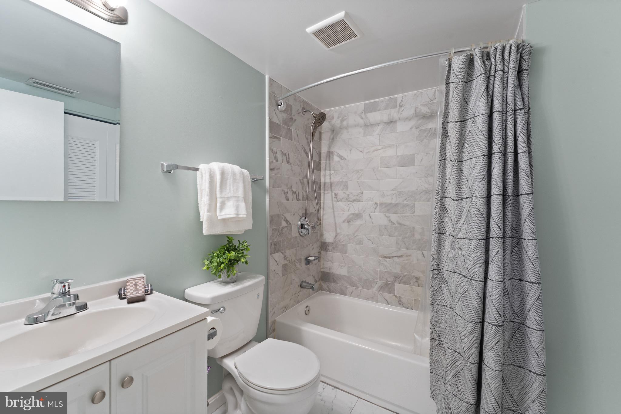 1617 Sierra Woods Drive Reston, VA 20194 - Photo 33 of 39 a bathroom with a sink toilet and shower