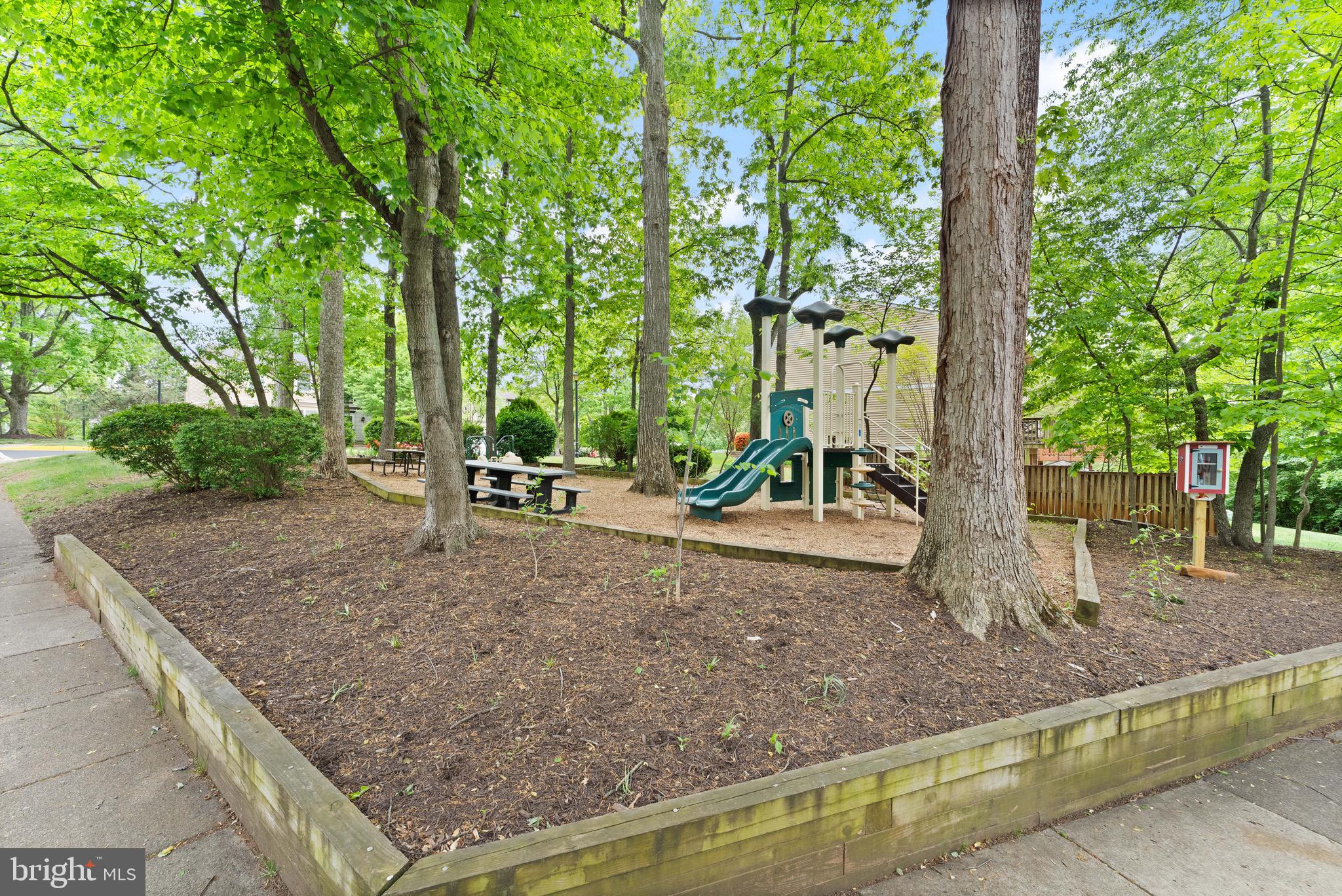 1617 Sierra Woods Drive Reston, VA 20194 - Photo 38 of 39 a backyard of a house with table and chairs