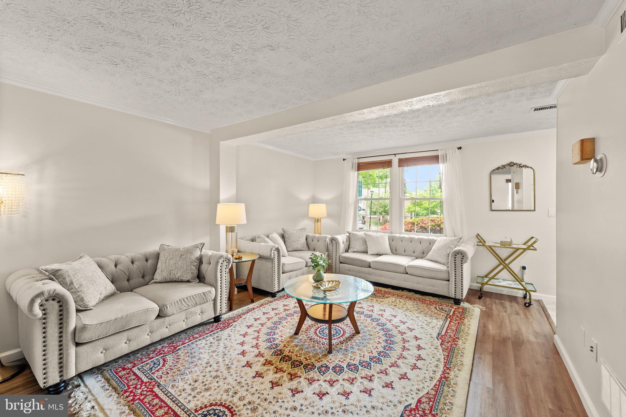 1617 Sierra Woods Drive Reston, VA 20194 - Photo 5 of 39 a living room with furniture a rug a lamp and a window