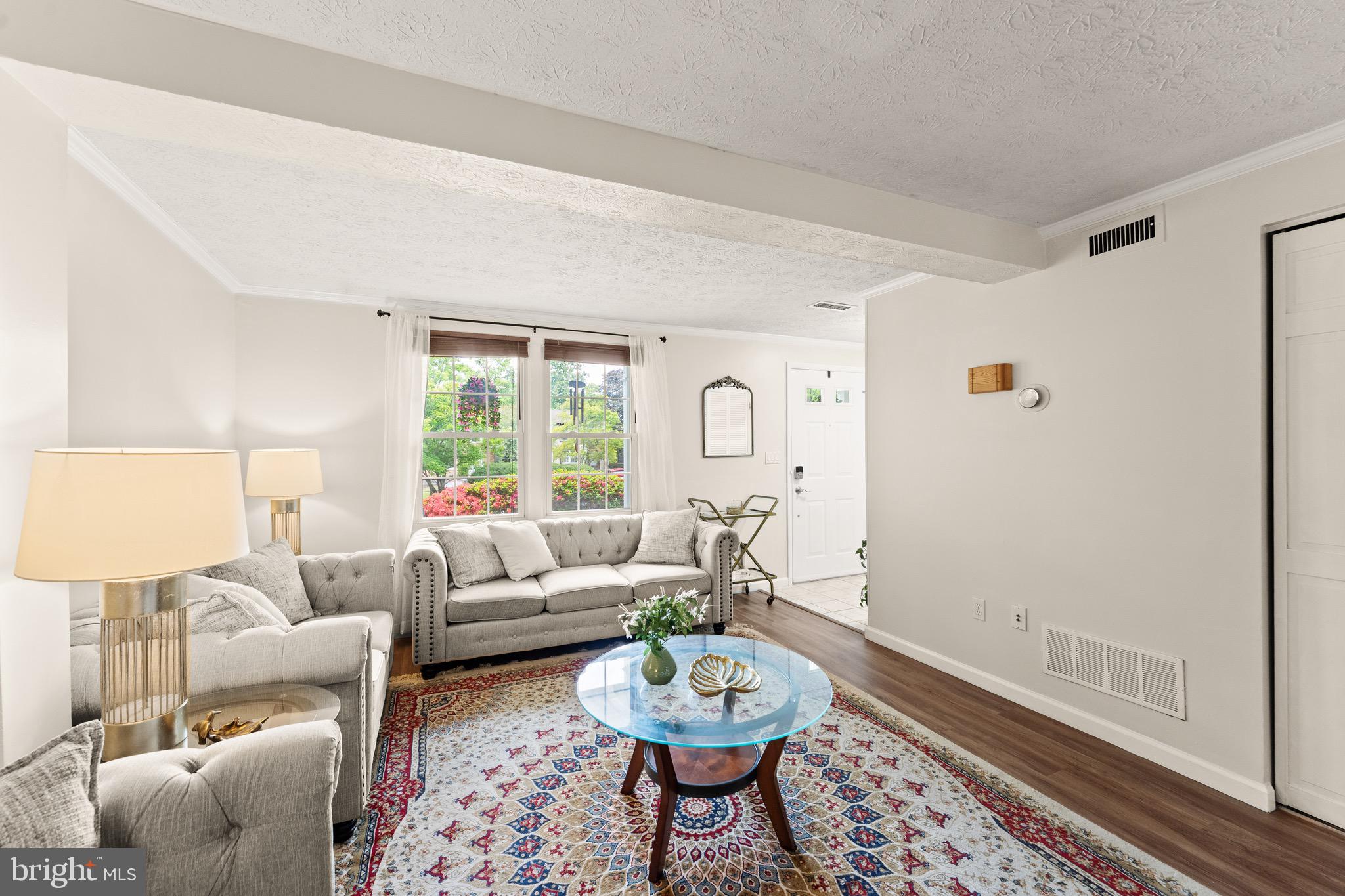 1617 Sierra Woods Drive Reston, VA 20194 - Photo 6 of 39 a living room with furniture and a large window