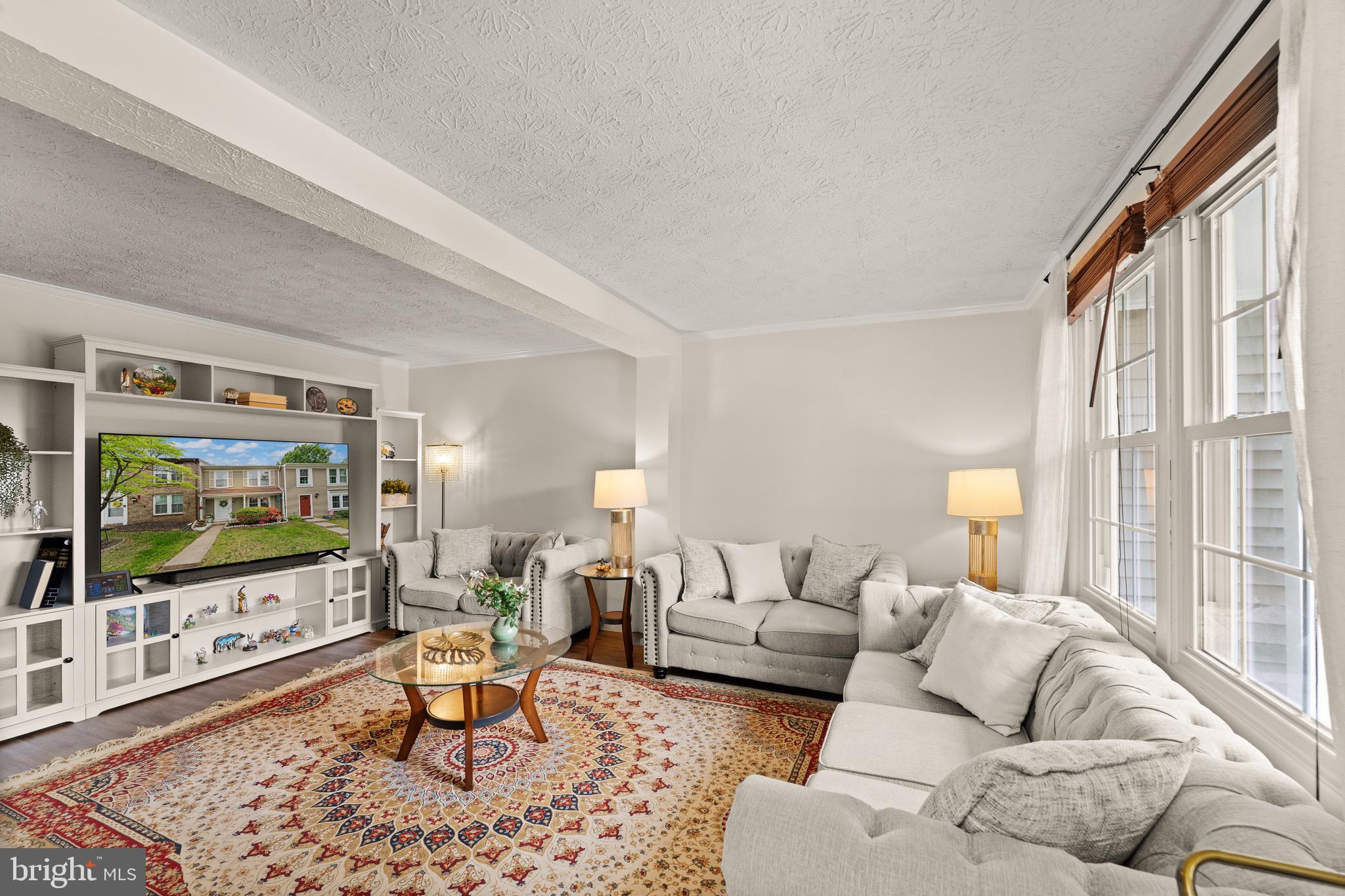 1617 Sierra Woods Drive Reston, VA 20194 - Photo 7 of 39 a living room with furniture and a flat screen tv