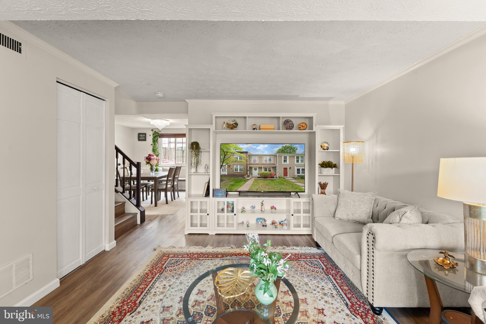 1617 Sierra Woods Drive Reston, VA 20194 - Photo 9 of 39 a living room with furniture and a flat screen tv