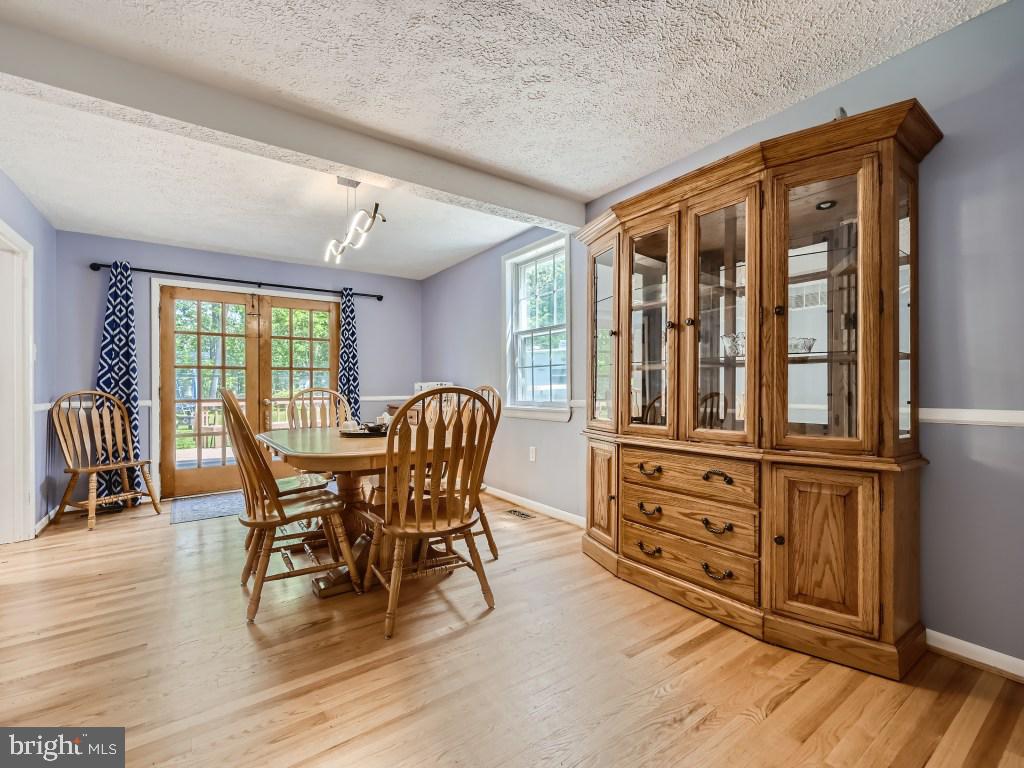 466 Edgewater Road Pasadena, MD 21122 - Photo 10 of 32 Formal Dining with Doors to Deck