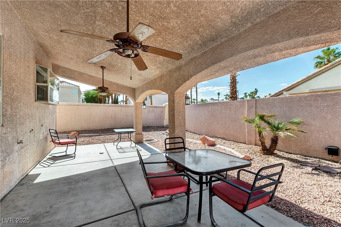 9156 Sapphire Point Avenue Las Vegas, NV 89147 - Photo 17 of 18 View of patio with outdoor dining space, a ceiling