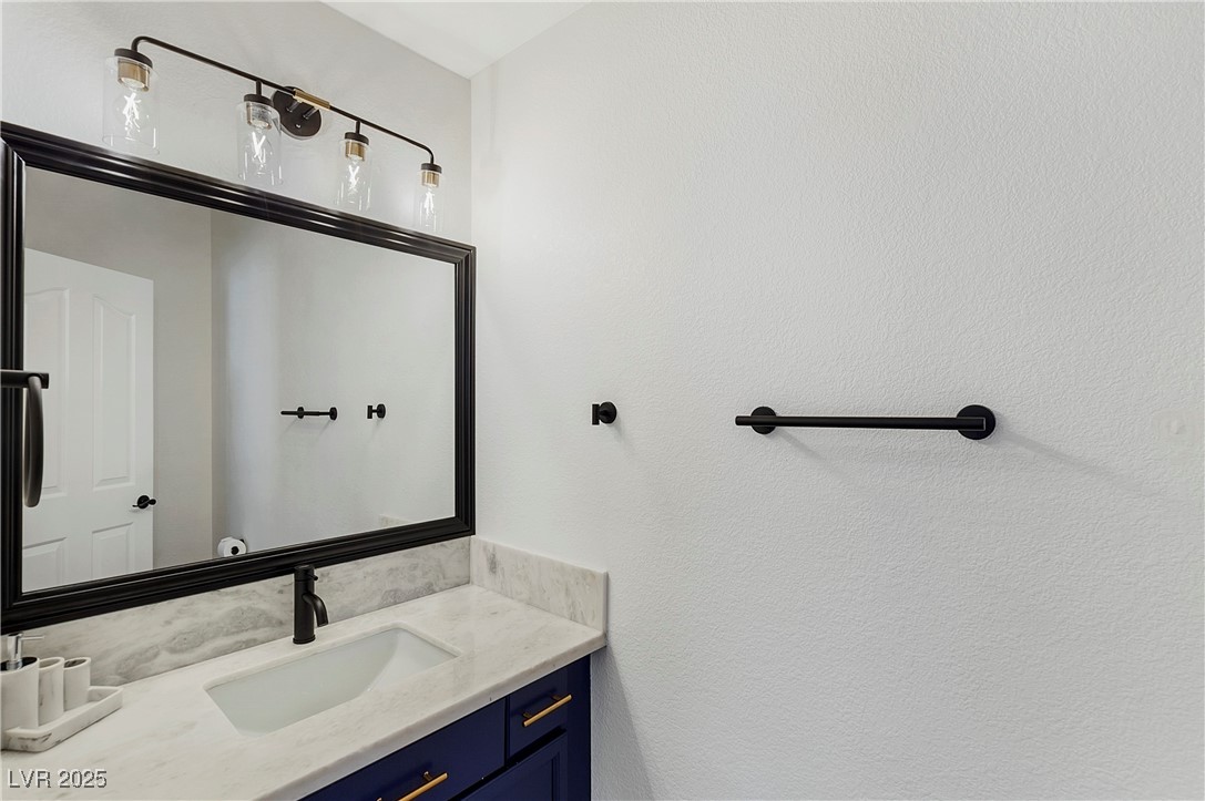 9156 Sapphire Point Avenue Las Vegas, NV 89147 - Photo 8 of 18 Bathroom with vanity
