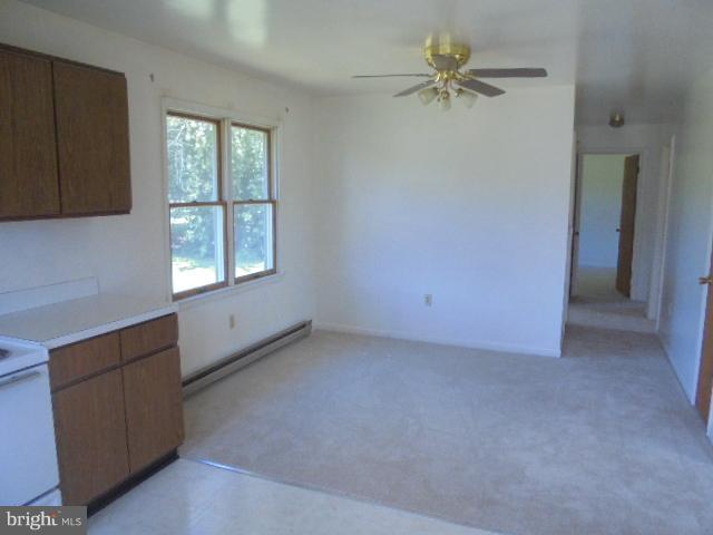 1721 Dudley Chance Road Millington, MD 21651 - Photo 18 of 21 an empty room with windows and fan