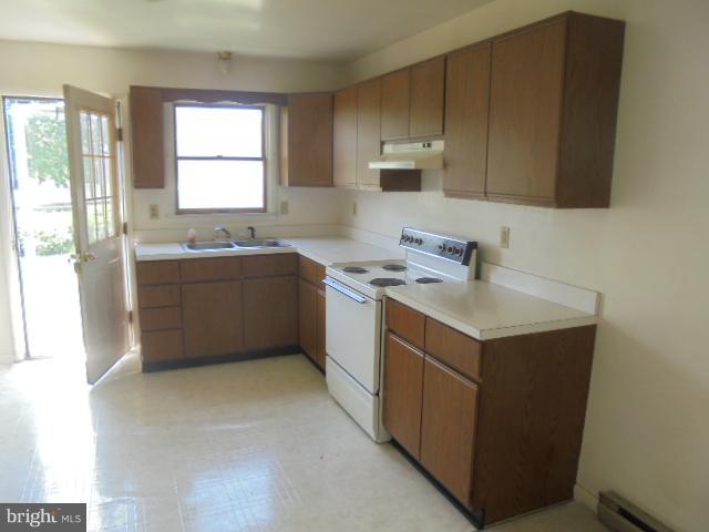 1721 Dudley Chance Road Millington, MD 21651 - Photo 9 of 21 a kitchen with a sink cabinets and a microwave