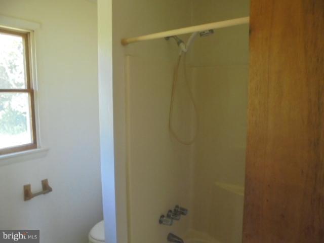 1721 Dudley Chance Road Millington, MD 21651 - Photo 10 of 21 a bathroom with a shower curtain
