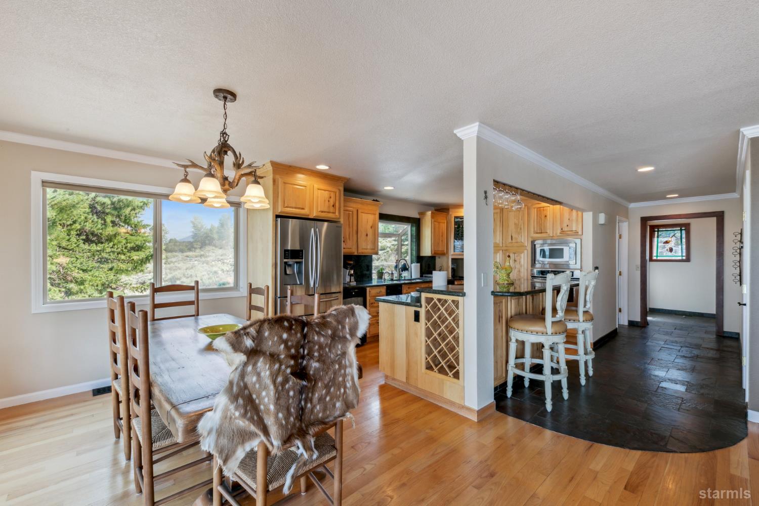 1299 Kingsbury Grade Road Gardnerville, NV 89460 - Photo 12 of 37 a view of a dining room with furniture window and wooden floor