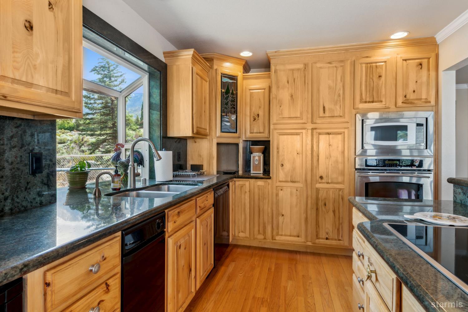 1299 Kingsbury Grade Road Gardnerville, NV 89460 - Photo 13 of 37 a kitchen with stainless steel appliances a sink and cabinets