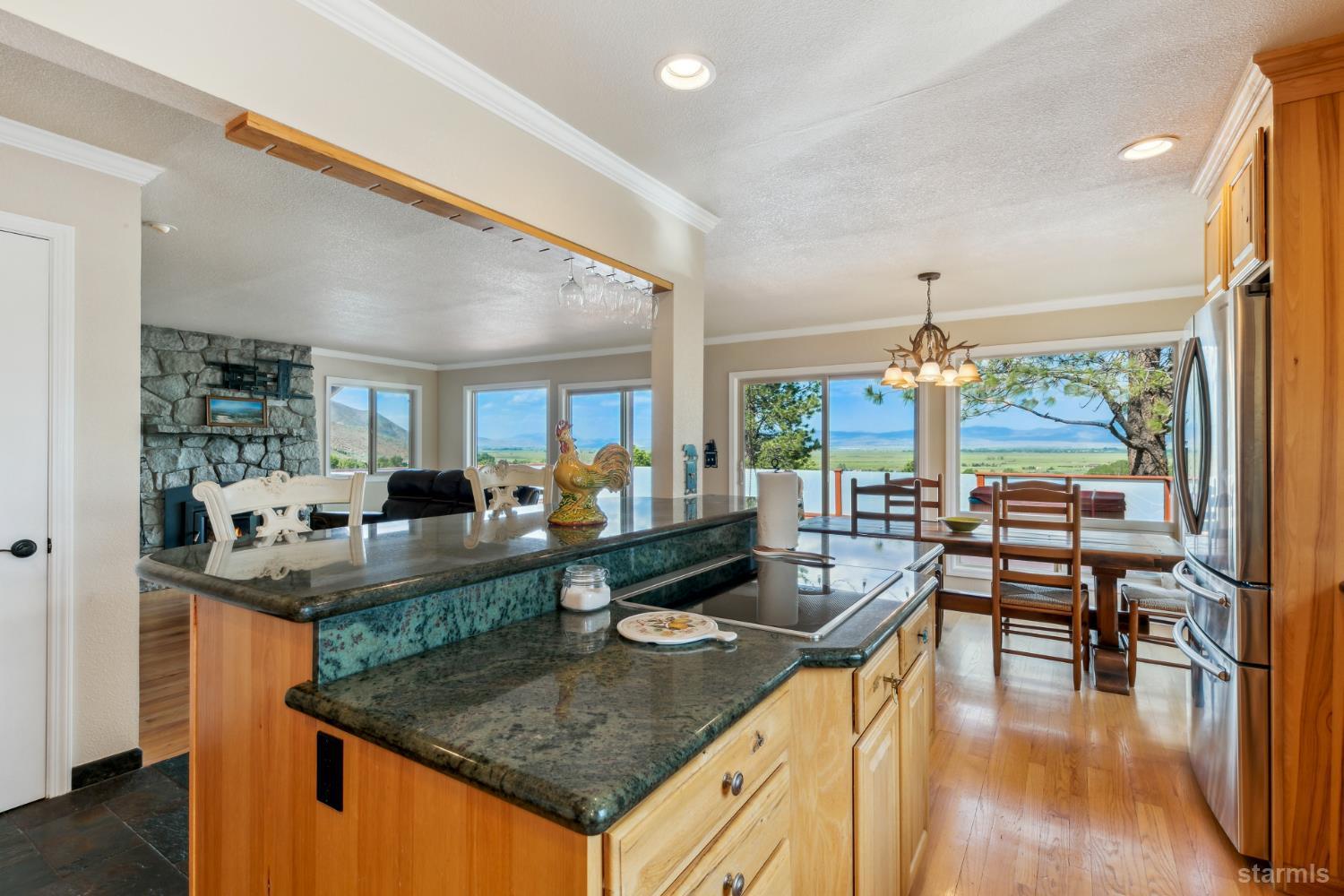 1299 Kingsbury Grade Road Gardnerville, NV 89460 - Photo 16 of 37 a kitchen with stainless steel appliances granite countertop a stove and cabinets
