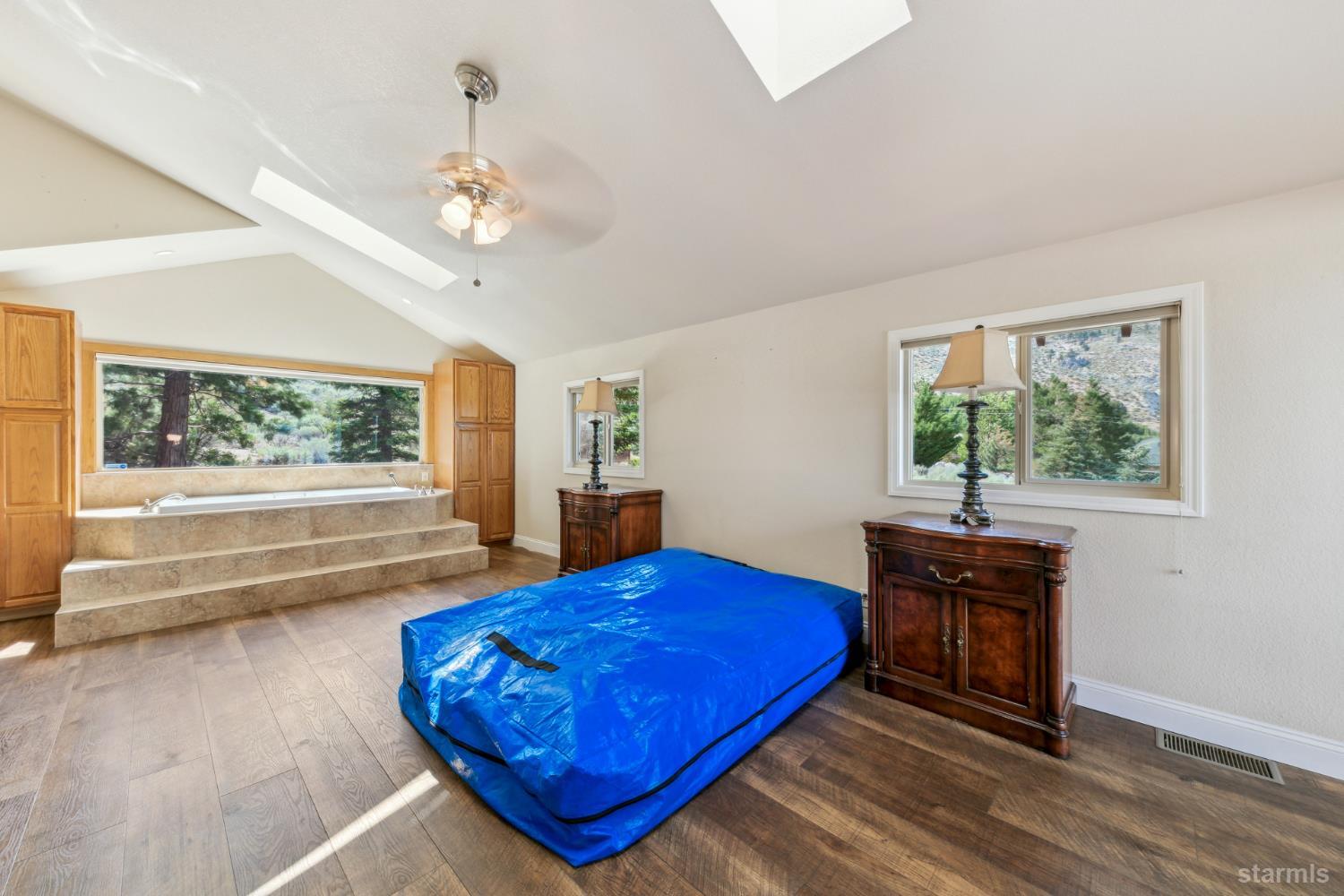 1299 Kingsbury Grade Road Gardnerville, NV 89460 - Photo 20 of 37 a living room with a bed furniture and a window