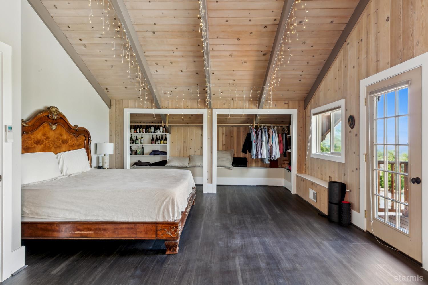 1299 Kingsbury Grade Road Gardnerville, NV 89460 - Photo 23 of 37 a bedroom with a large bed and a book shelf