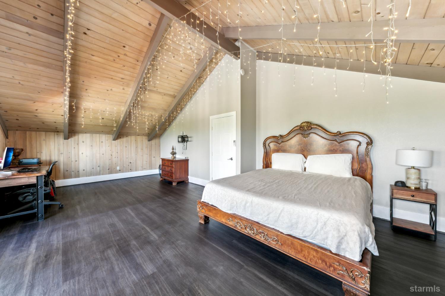 1299 Kingsbury Grade Road Gardnerville, NV 89460 - Photo 24 of 37 a bedroom with a bed and a mirror