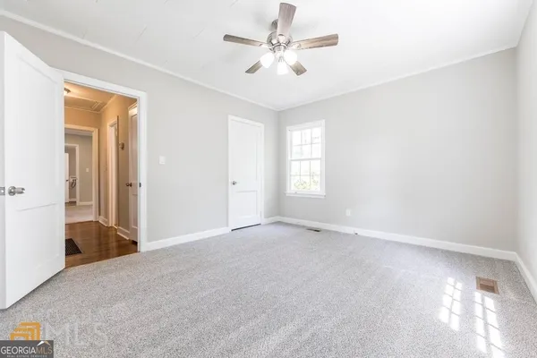 a view of an empty room with a window