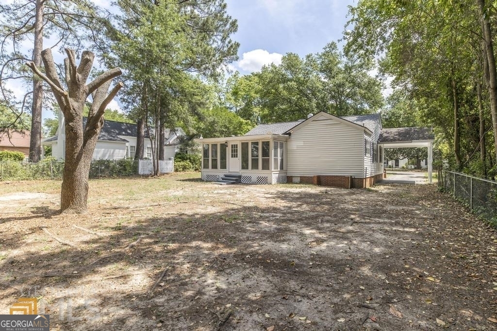 214 Mimosa Drive Dublin, GA 31021 - Photo 19 of 19 a view of a house with a yard