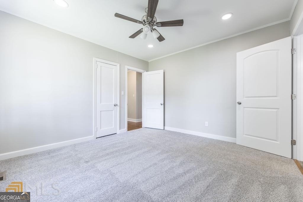 214 Mimosa Drive Dublin, GA 31021 - Photo 10 of 19 an empty room with windows and fan