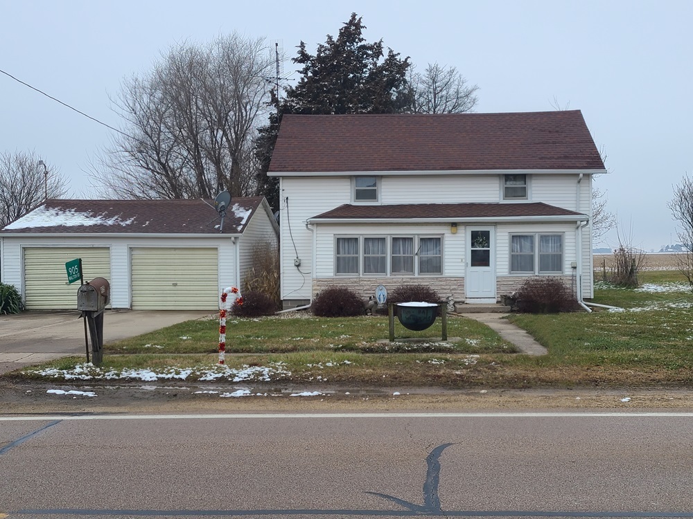 905 Walton Road Dixon, IL 61021 - Photo 1 of 18 a front view of a house with garden and parking