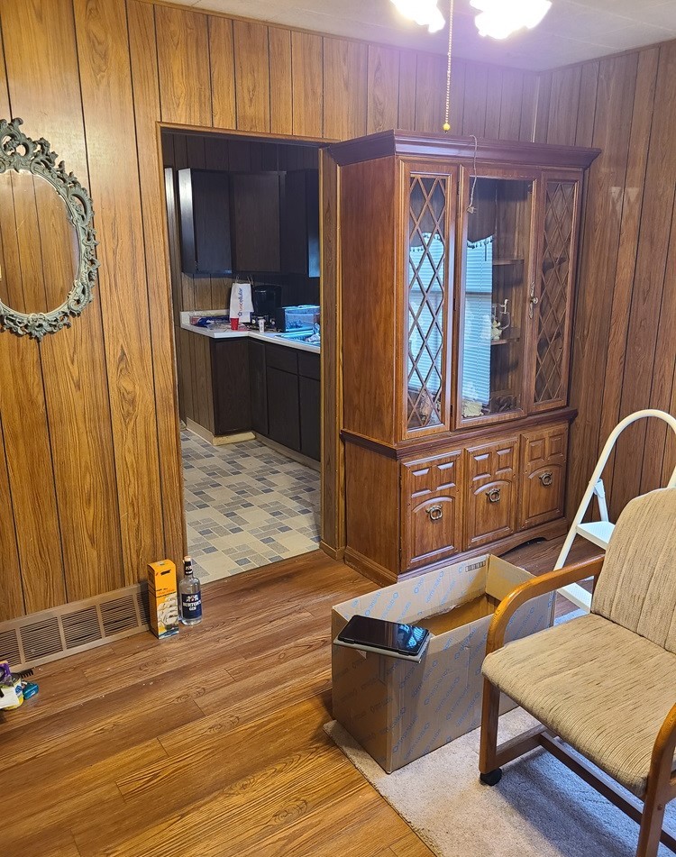 905 Walton Road Dixon, IL 61021 - Photo 4 of 18 a living room with furniture a wooden floor and a window